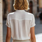 Structured Short Sleeve Stand Collar Blouse With Pleated Front Panel