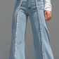 High-Waisted Light Blue Flared Jeans With Raw Edge Seams