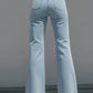 High-Waisted Light Blue Flared Jeans With Raw Edge Seams