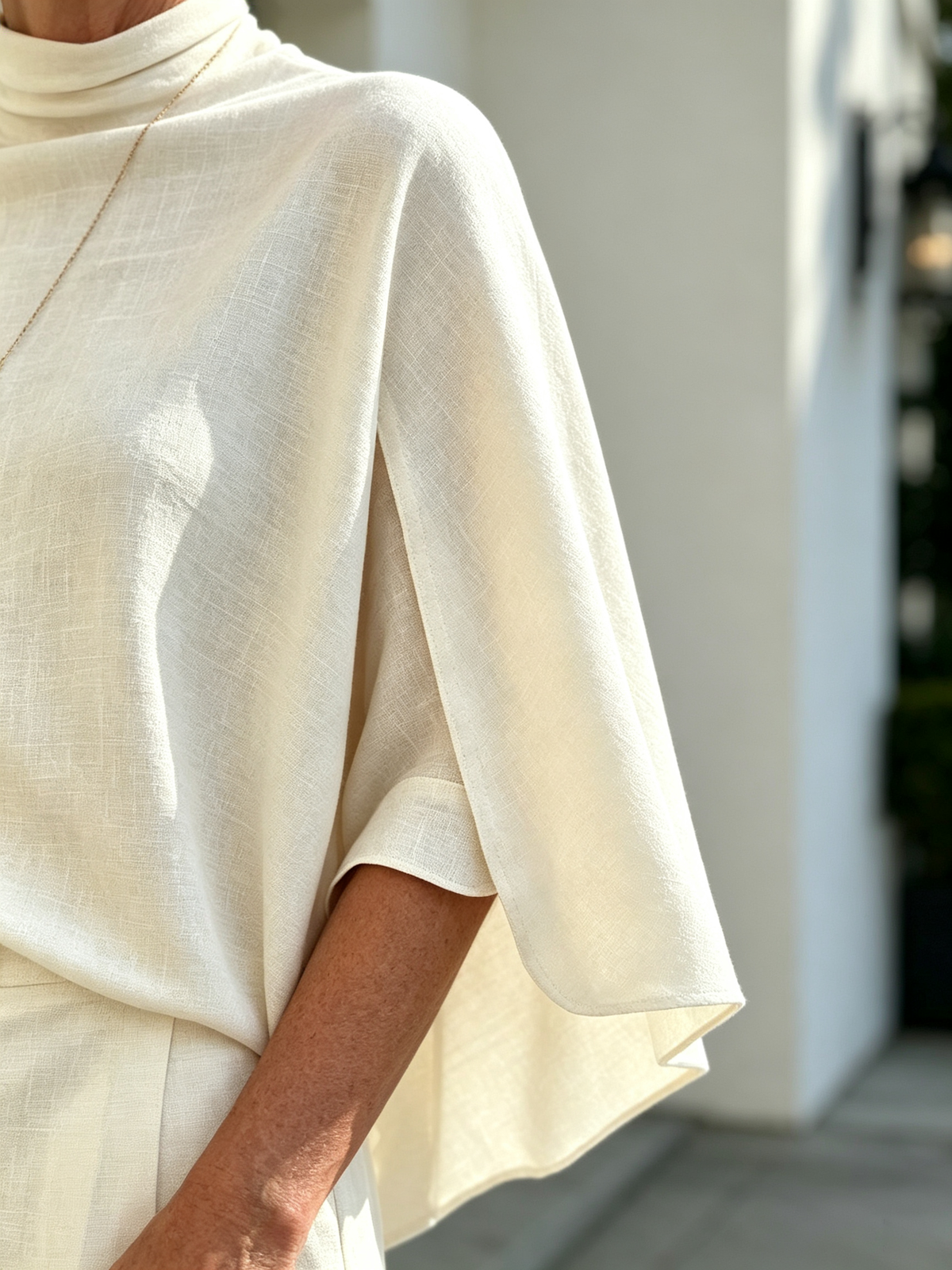 Solid Color 2 Piece Outfit Set, Semi High Mock Neck Cape Sleeve Blouse, High Waist Split Wide Leg Pants, Light Textured Woven Fabric, Relaxed Elegant Silhouette, Flowy Cape Top and Front Slit Trousers for Formal and Semi-formal Occasions